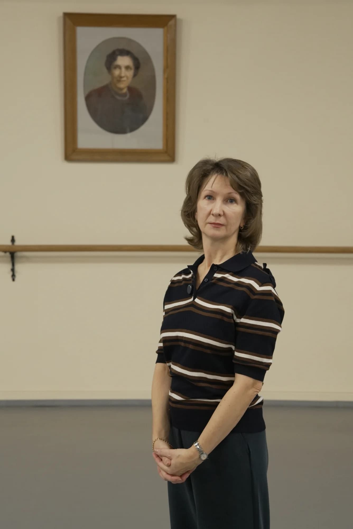 Tatiana Cherkashina in a studio of the Vaganova Ballet Academy, beneath the portrait of Agrippina Vaganova